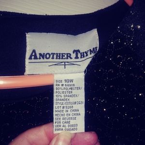 Black one piece pant suit.